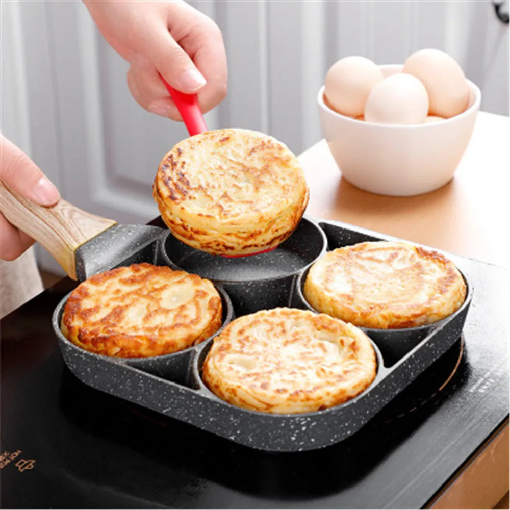 Four compartment non-stick aluminium frying pan with Bakelite handle for cooking eggs and pancakes