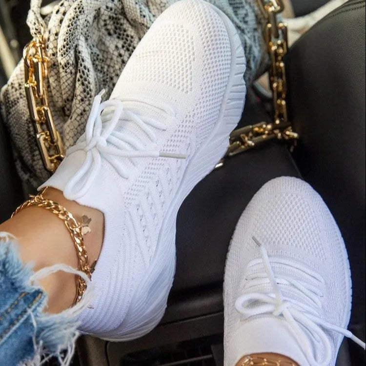Women's solid colour sneakers with a thick sole, shown in one of nine available colours.