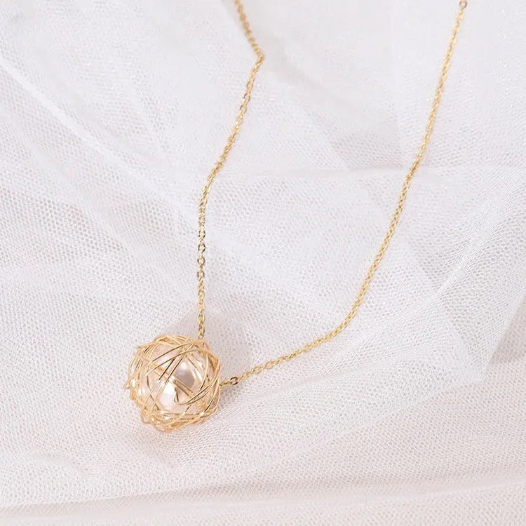 Gold minimalist pendant necklace with hollow ball and imitation pearl on twist chain 78cm
