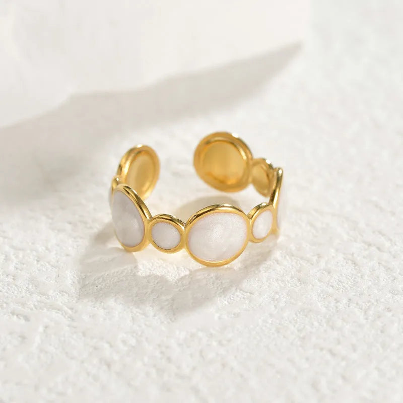 Adjustable stainless steel geometric ring with electroplated finish shown on hand