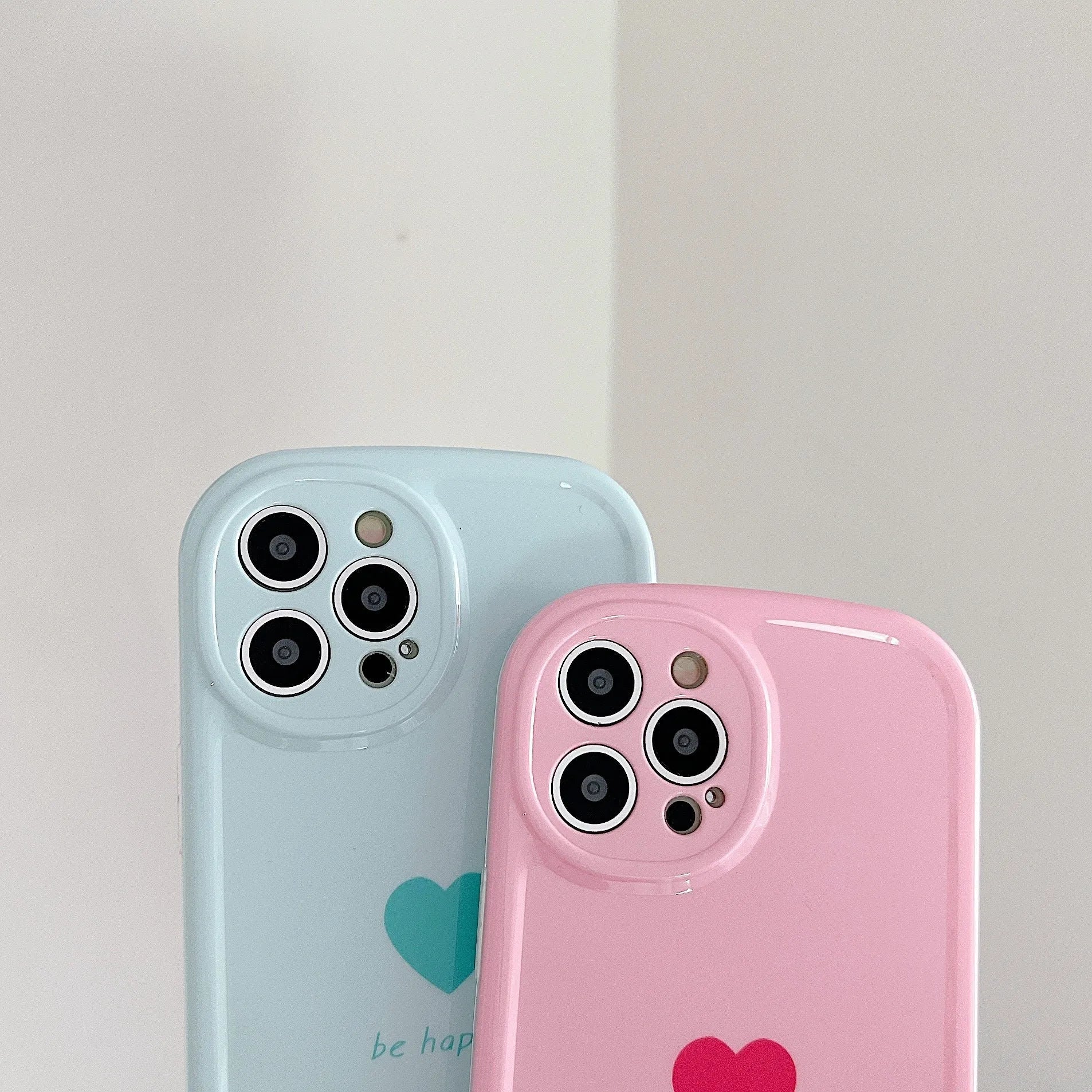 Cute macaron colour love phone case for iPhone in pink, purple, blue, and white options with TPU PC hard back cover