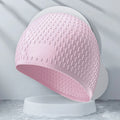 Solid colour silicone swimming cap with water drop design for adult swimmers