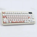 Round mechanical keyboard key cap set with colourful dessert cat cartoon design.