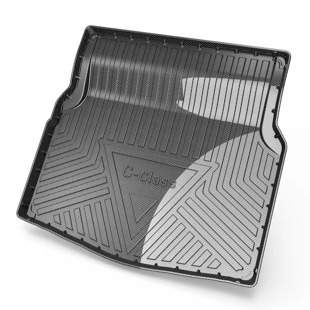 Black car boot liner with carbon fibre pattern texture, made from TPE material.
