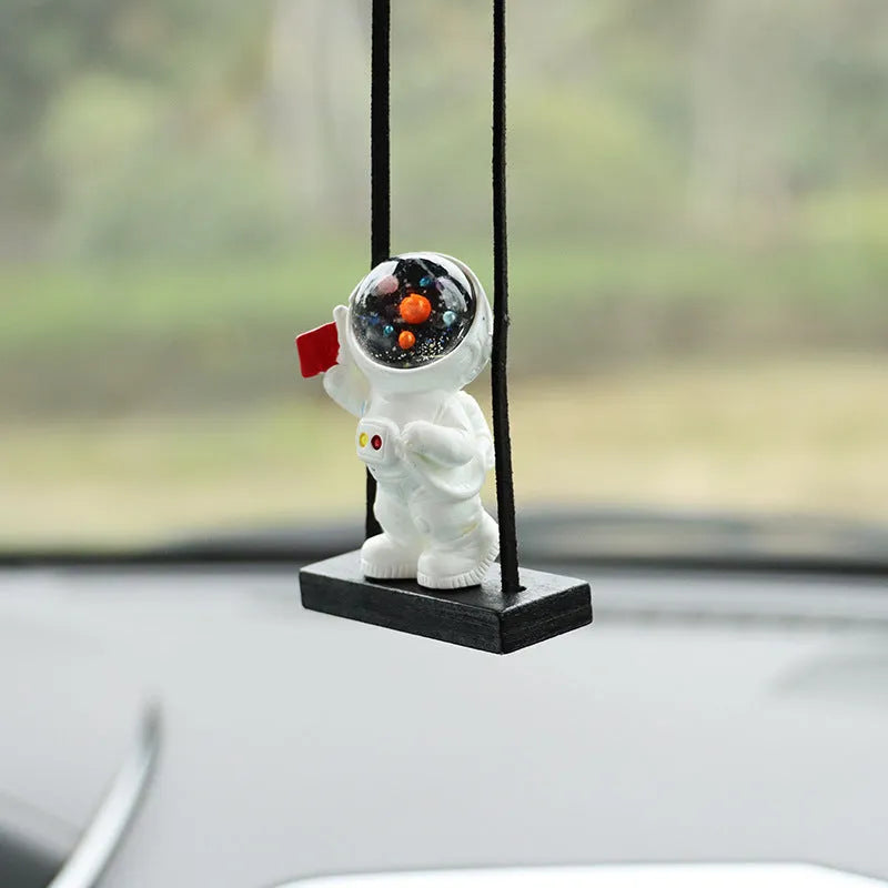Resin astronaut car pendant with red flag, telescope, and radish designs