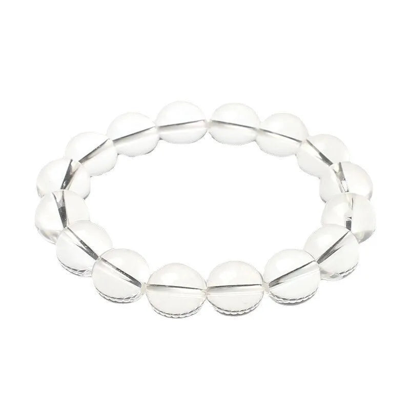 Natural old mine white crystal bead bracelet with geometric design on a wrist.