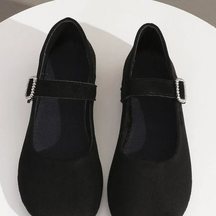 Men's solid black flat fisherman shoes with canvas upper and rubber sole on a white background.