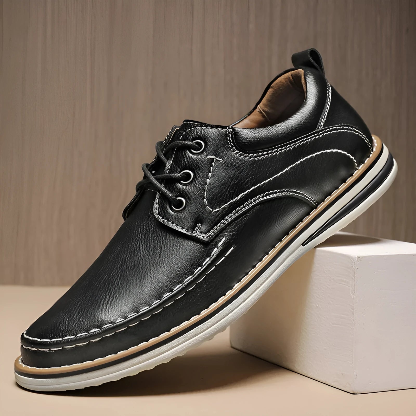 Men's black genuine leather lace-up casual shoes with round toe and low rubber sole on a white background.