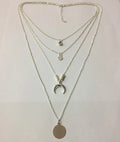Geometric multi-layer moon disc pendant in gold alloy finish on a white background