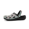 Black women's platform sandals with rhinestone detail and hole design on EVA upper