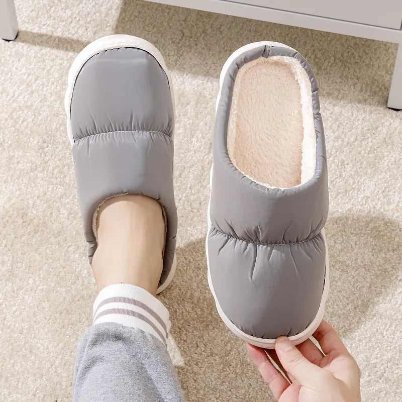 Blue thick-soled indoor slippers with artificial leather upper and plush lining on a rubber sole.