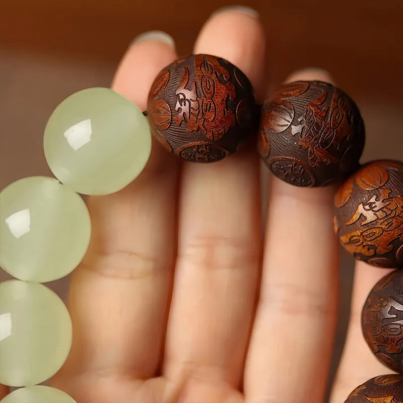 Rosewood bracelet with carved Fu character design in amass fortunes colour, showing 20mm size and flexible ring construction
