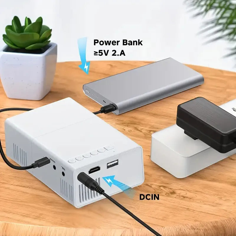 M100 portable mini projector in black or white colour showing remote control and cables