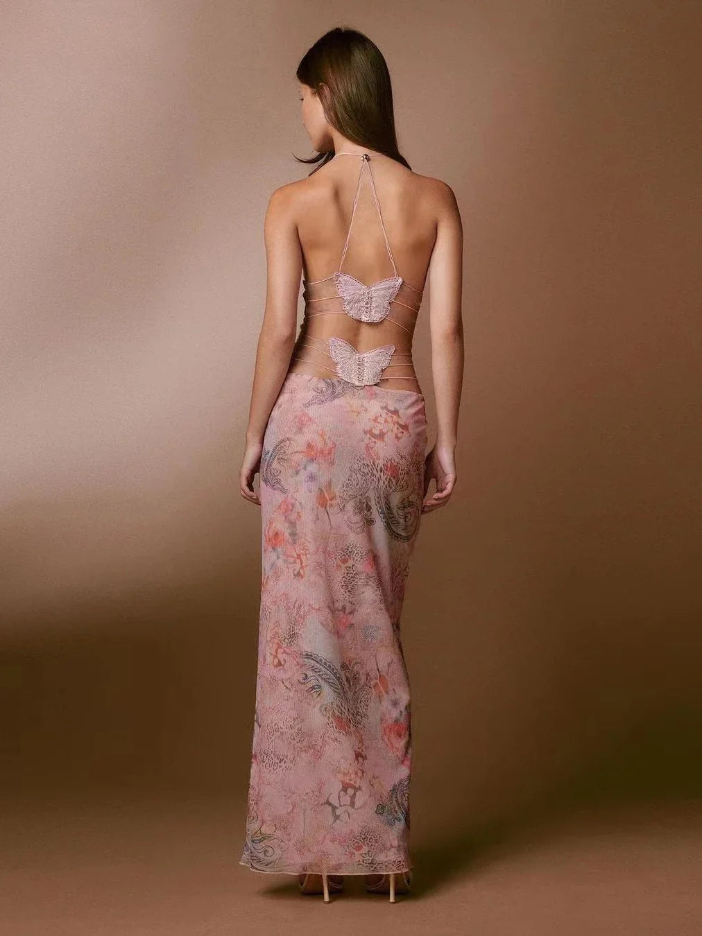 Floral print halter dress with spaghetti straps, slim silhouette, and butterfly back design, available in various colors