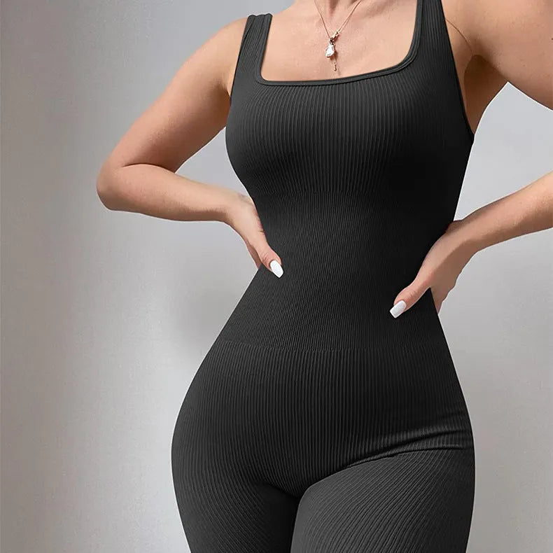 Women's beige long sleeve suspender tights with tank top straps and button details on a mannequin.