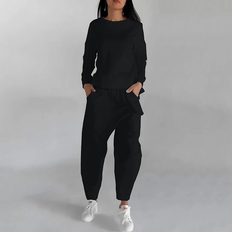 Stylish polyester sweatshirt with unique back slit design and convenient pockets for a fashionable and functional look.