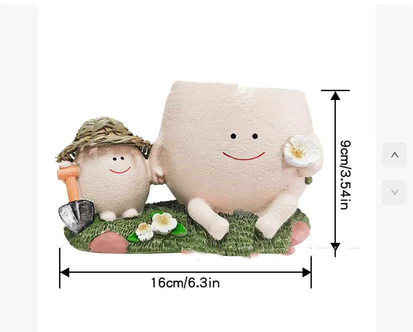 Ukulele-shaped resin succulent flower pot in office decoration setting.
