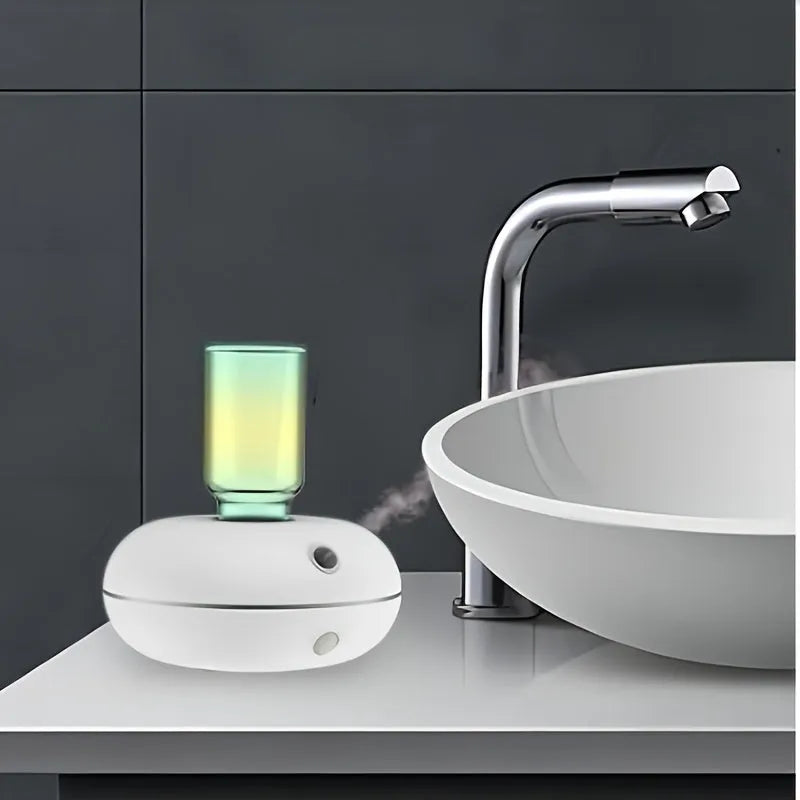 White automatic sensor fragrance machine mini USB diffuser for home bathroom use on a shelf