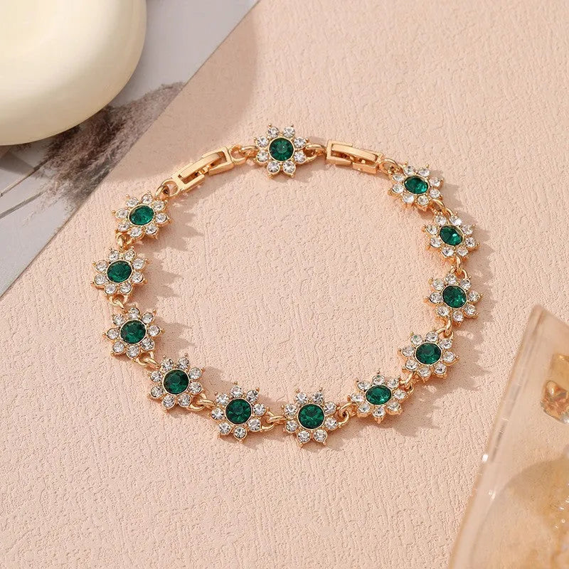 Luxury style bracelet with coloured gems and floral design on zinc alloy with electroplated finish