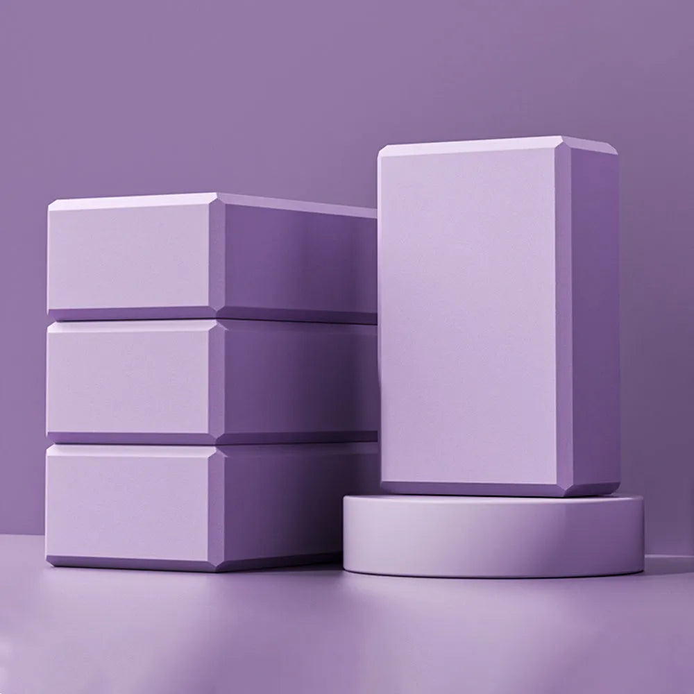 Solid colour EVA yoga block with grip ridges measuring 23x15x7.6cm