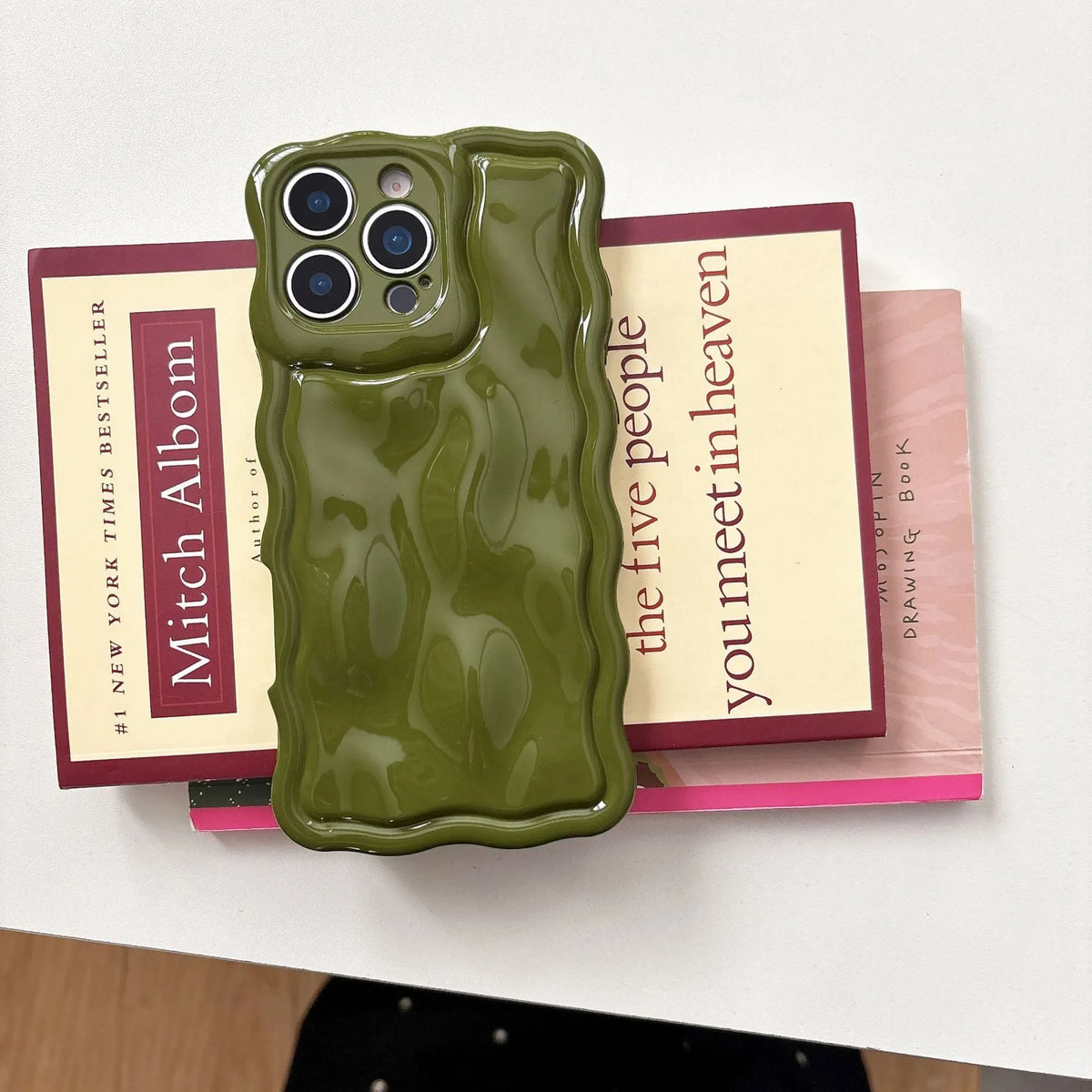 Water ripple TPU iPhone case in light pink with anti-fall and anti-fingerprint finish, oil-filled wave texture