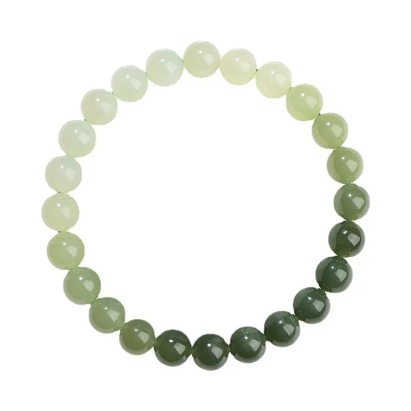 Natural clear water Hetian jade ball bracelet with round and barrel bead options.