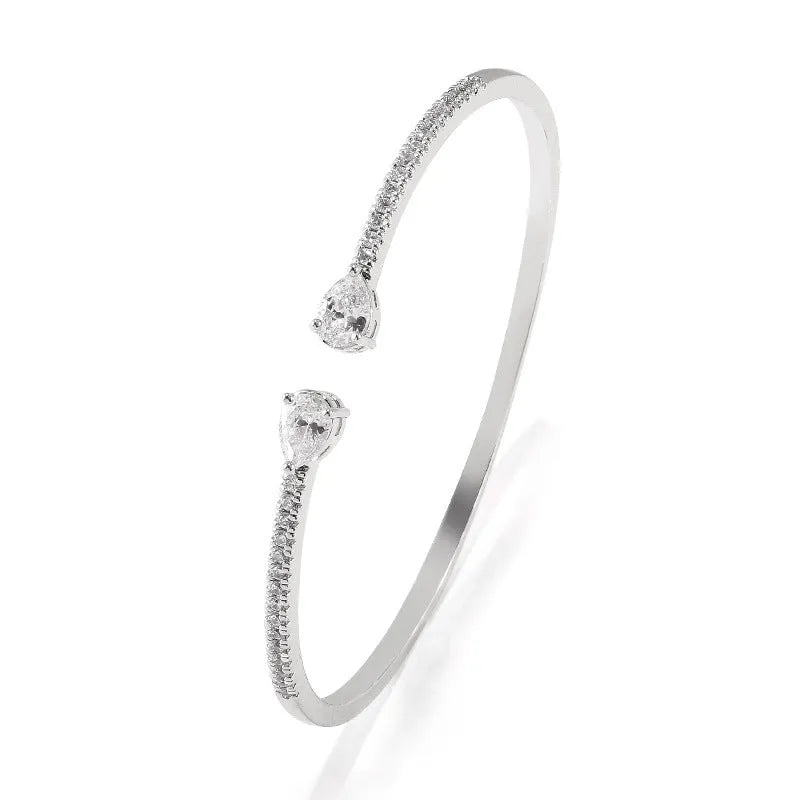 Personalised copper bracelet with multi-zircon inlay, shown in white and blue colour options