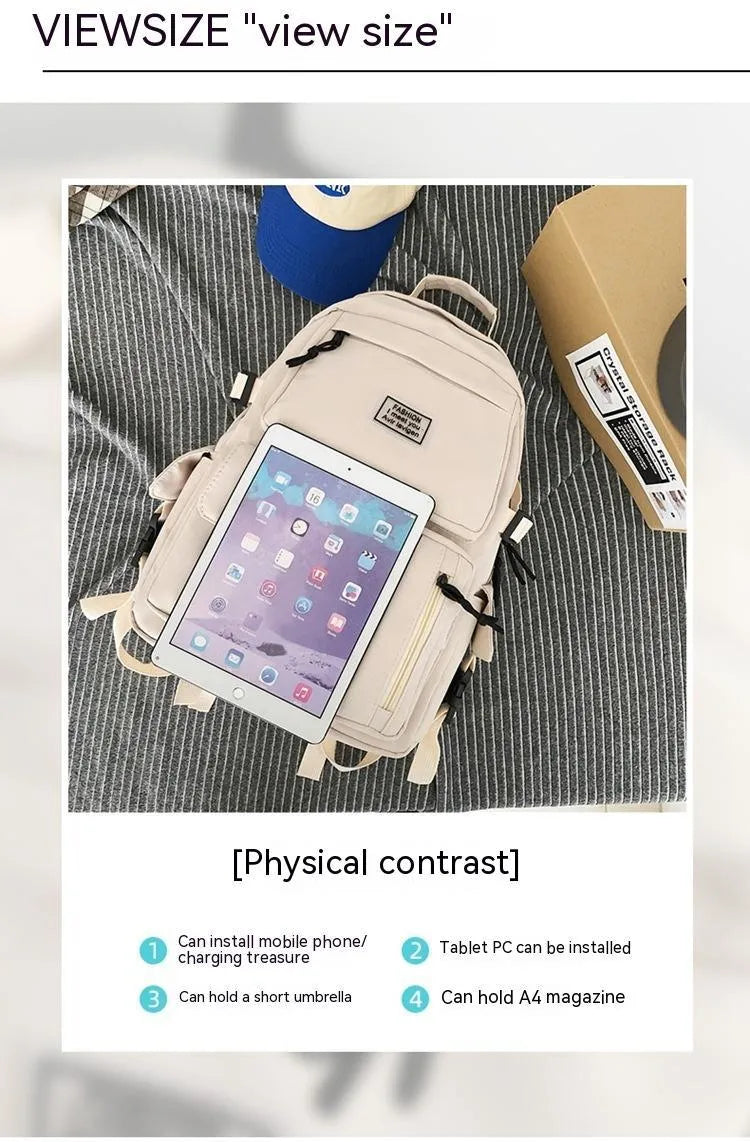 Black or white nylon student backpack with computer compartment measuring 31x12x41cm