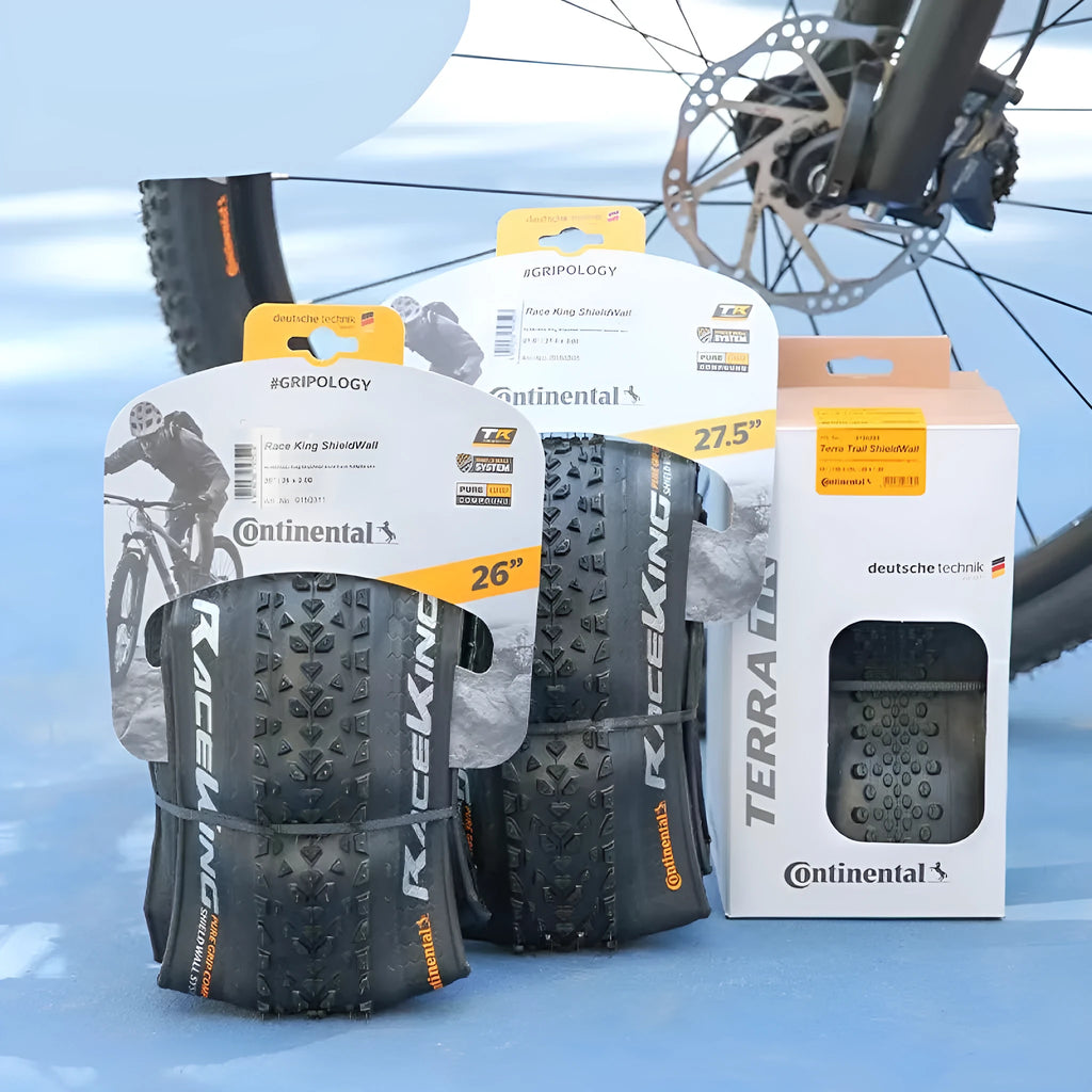 Mountain bike outer tyre showing tread pattern, available in 26, 27.5 and 29 inch sizes with black or skinwall sidewalls.
