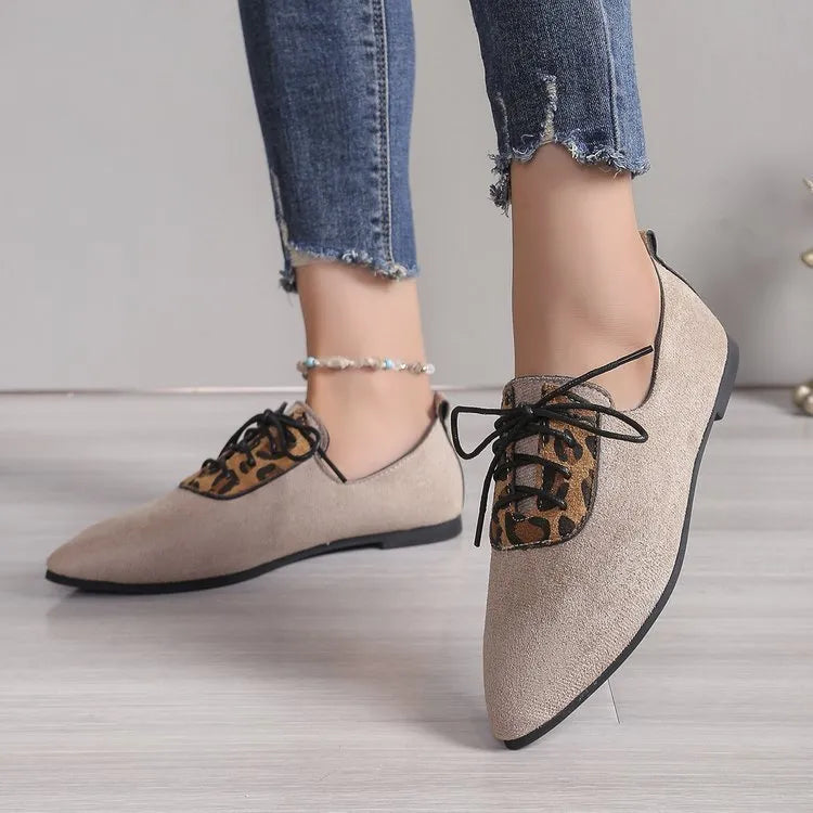 Beige leopard print pointed toe stiletto pumps for women, showing the shoe's side profile.