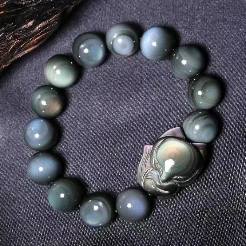 Obsidian bracelet carved with fox or zodiac animal design in cartoon style
