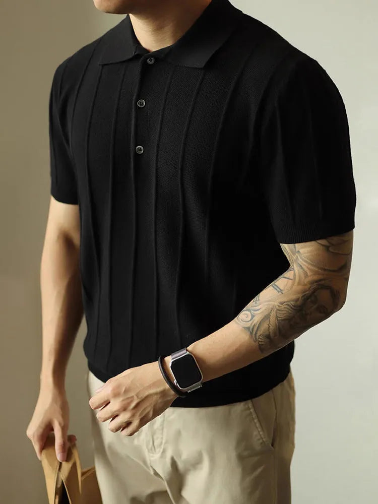 Man wearing a solid black loose fit basic polyester T-shirt for casual wear.