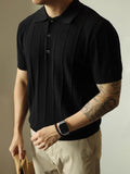 Man wearing a solid black loose fit basic polyester T-shirt for casual wear.