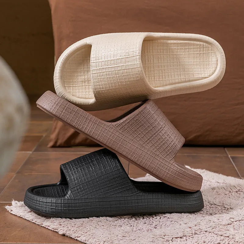 A pair of khaki coloured EVA toe ring slippers with a soft non-slip sole, shown on a white background.