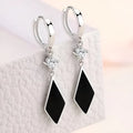 A pair of silver vintage diamond geometric earrings made from zinc alloy with electroplating.