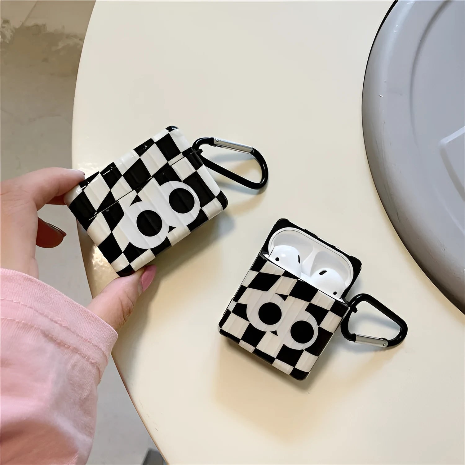 Checkerboard black and white grid TPU protective cover with large cartoon eyes for AirPods 1 2 3