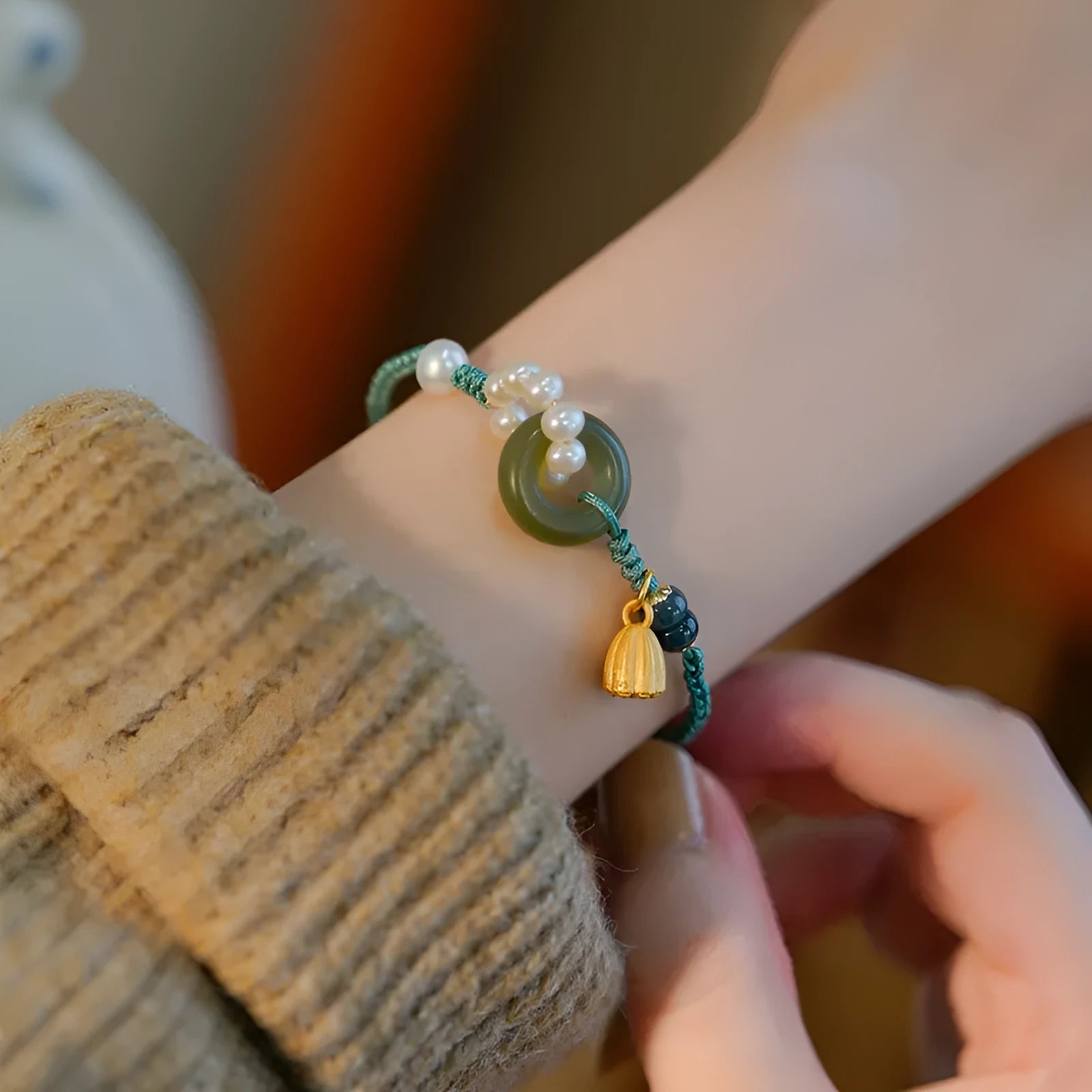 Hand-woven round watch band made from flexible wire with a Pearl Peace Buckle clasp