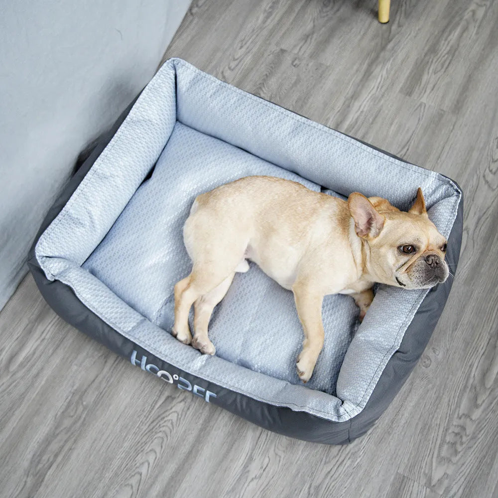 Soft grey dog bed with cat cave design and removable cover shown in small, medium, and large sizes.