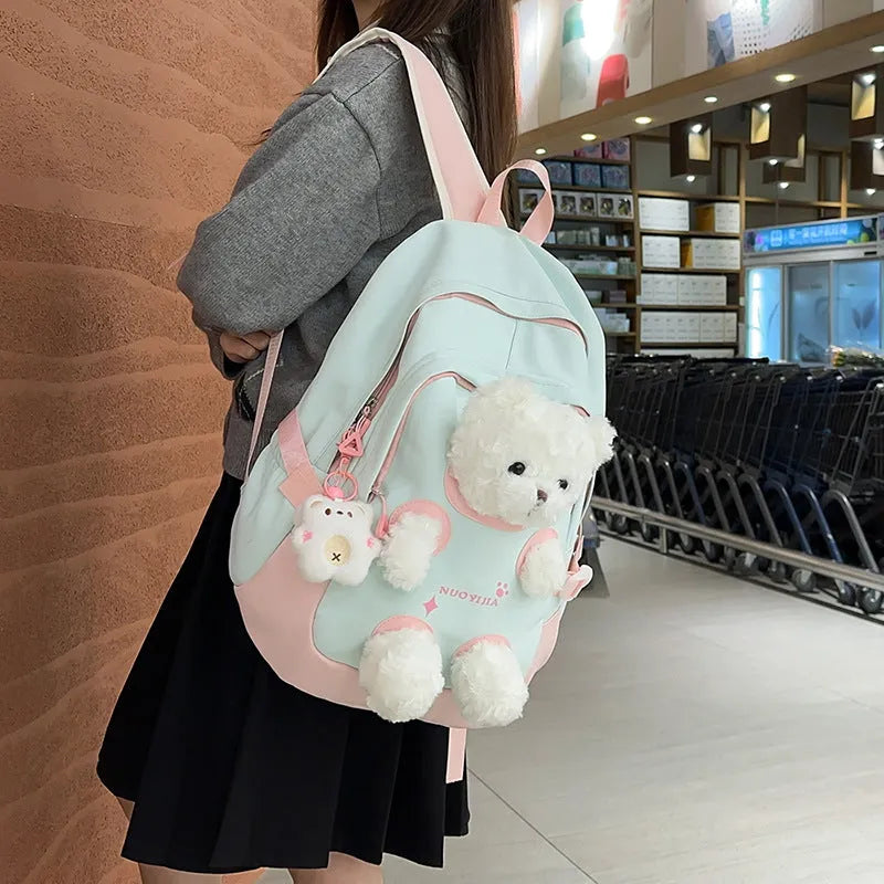 Yellow pink nylon backpack with bear design and curved shoulder straps, 20-35L capacity.