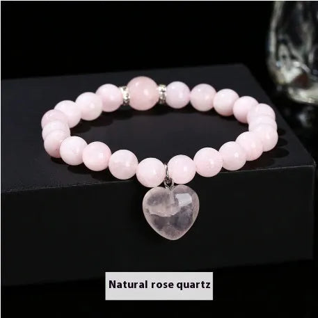 Handmade geometric love pendant bracelet with natural crystal beads in pink, green, white, or yellow.