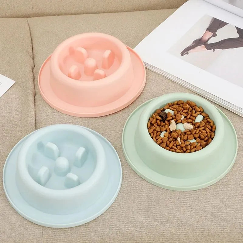 Blue slow feeder dog bowl with raised maze pattern and non-slip base.