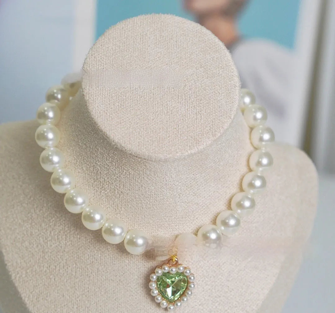 A decorative gem-style cat collar in plastic alloy resin, shown in multiple solid colours with adjustable sizing.