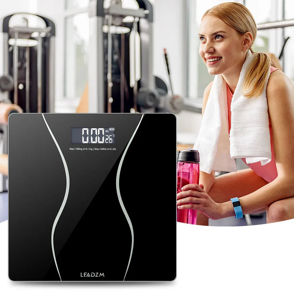 Black electronic bathroom scale with digital display for weight measurement up to 180 kg