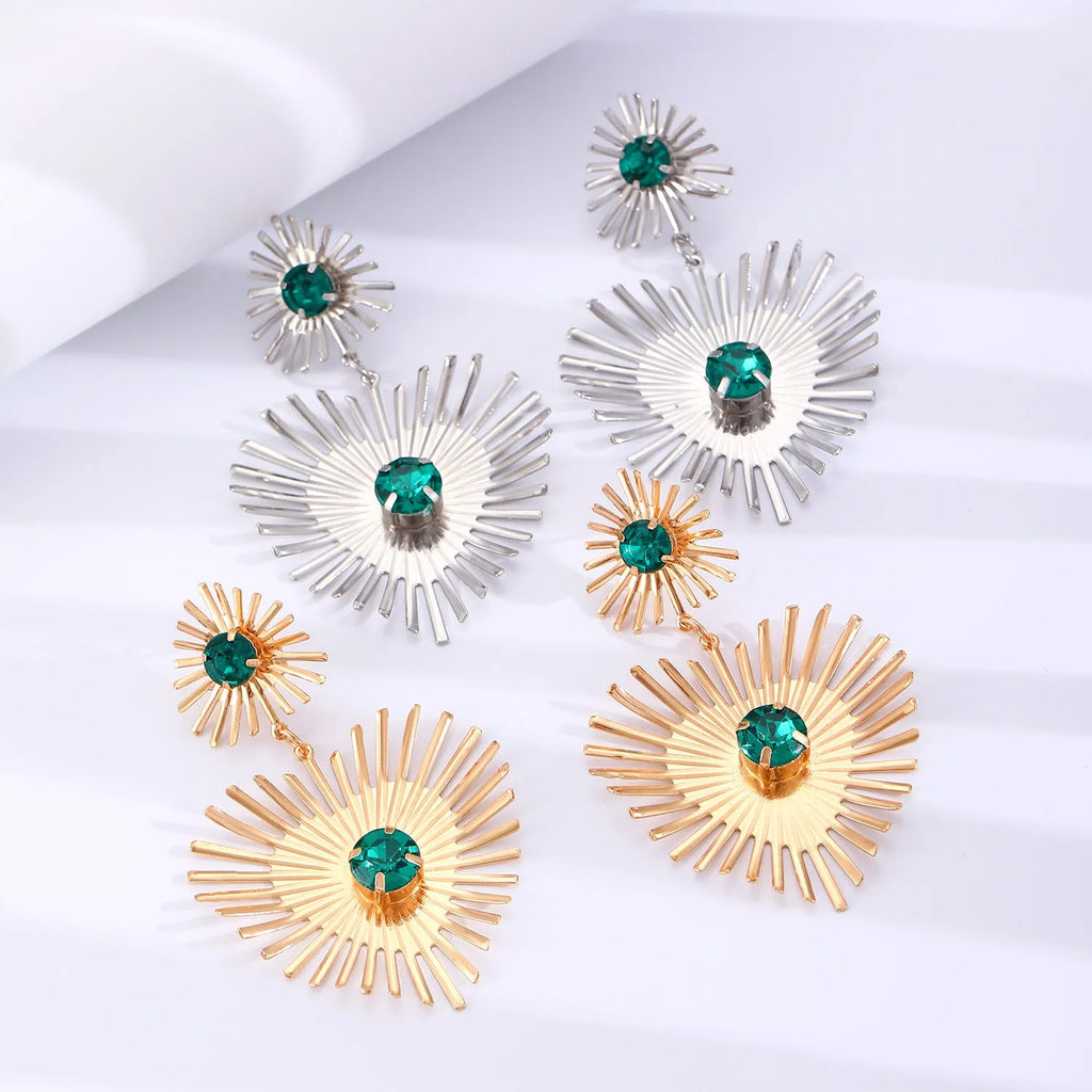 Bohemian sunflower heart-shaped earrings with rhinestones in gold finish on a white background