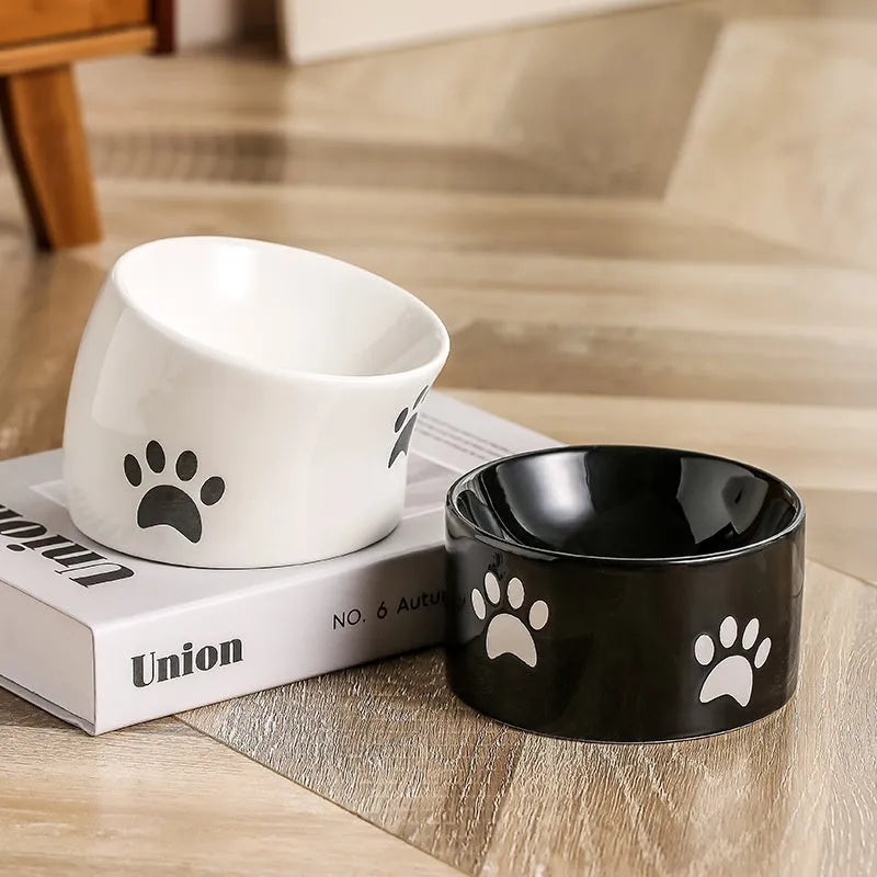 Ceramic cat bowl with oblique mouth and high foot in cat's paw black colour