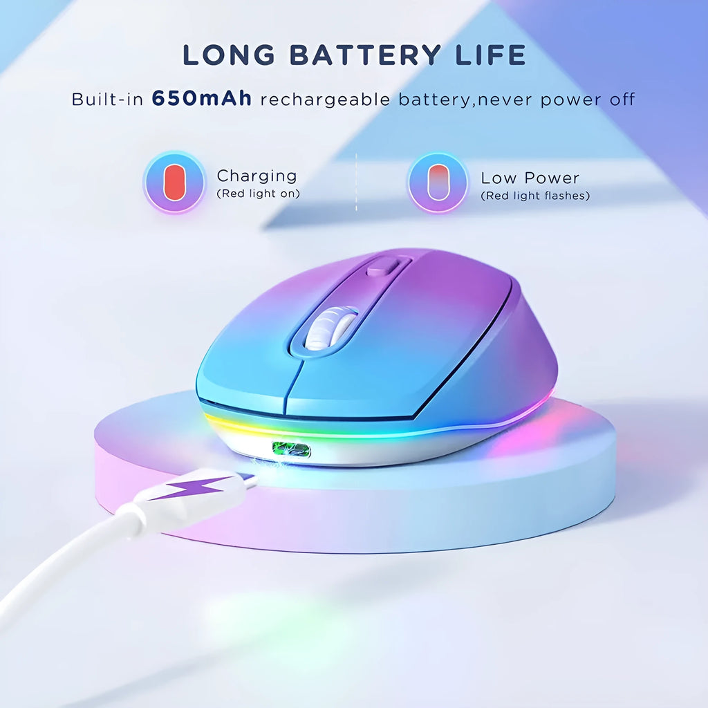 Compact white wireless mouse with ergonomic shape on a desk next to a laptop