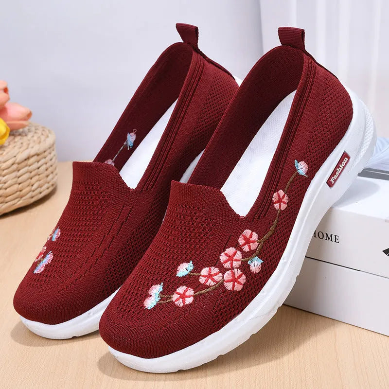Women's embroidered woven casual pump in wine red with a low heel and anti-slip sole.