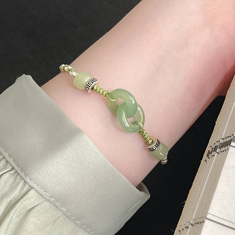 Green copper bracelet with ethnic peace buckle design and jade double ring strap
