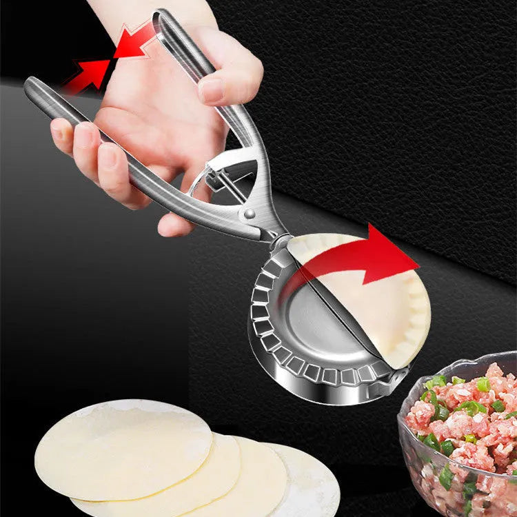 Silver stainless steel manual dumpling maker tool for pressing homemade dumplings.