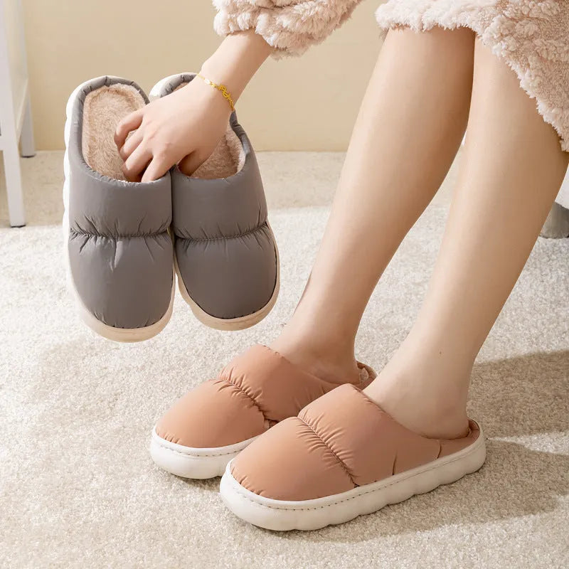 Blue thick-soled indoor slippers with artificial leather upper and plush lining on a rubber sole.
